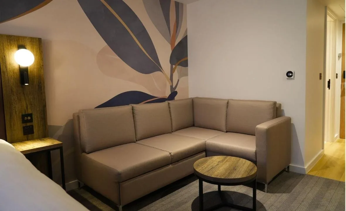 a living room with a couch and a table at Holiday Inn London Camden Lock by IHG in London