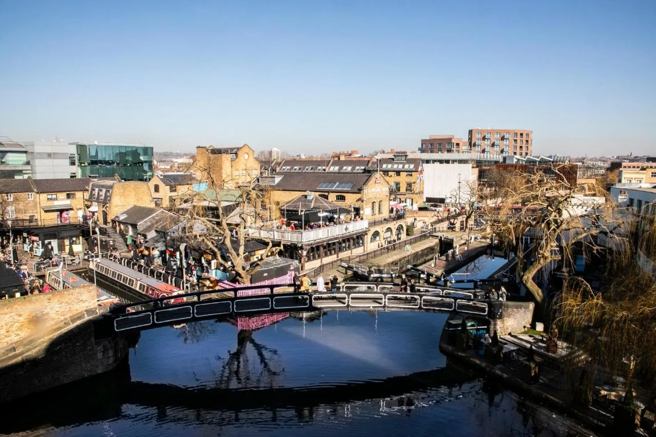 a bridge over a river in a city at Holiday Inn London Camden Lock by IHG in London